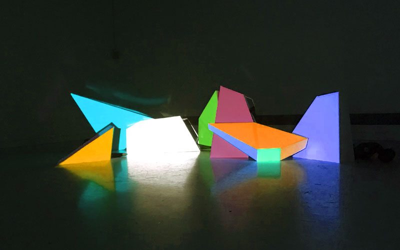 Set elements are projection mapped on with colours and images